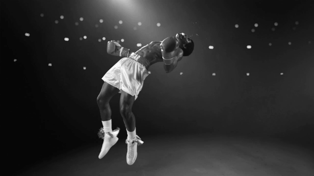 Screenshot from the "Lots O' Spots" campaign featuring a boxer floating in mid air in slow motion